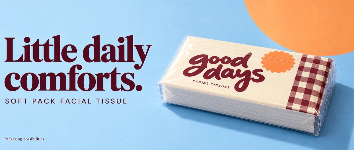 Original Good Days soft pack facial tissue concept with burgundy lettering, gingham and an apricot sun on a low transparent film pack against blue