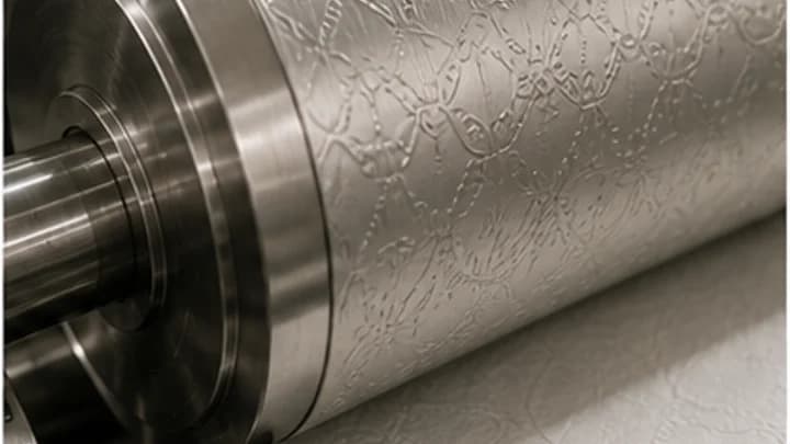 Embossed tissue sheets feeding through stainless steel converting equipment